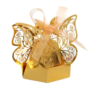 Golden laser-cut butterfly gift box with orange ribbon for wedding candy and party favors