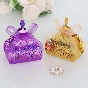 Detailed laser cut princess dress favor box with glitter texture and organza ribbon