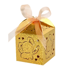 Glitter gold laser-cut elephant wedding favor box with a soft peach pink ribbon bow