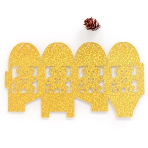 Detailed laser-cut teddy bear patterns on gold glitter paper party gift box template