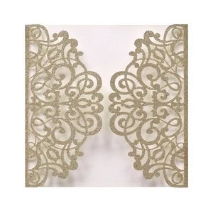 Detailed laser-cut vine patterns on champagne gold glitter invitation cover for weddings
