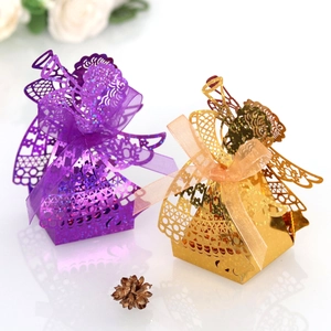 Detailed laser-cut angel gift boxes with glitter paper and silk ribbons for weddings