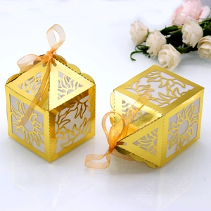 Golden laser-cut paper gift box with sun pattern hollow design and orange ribbon bow