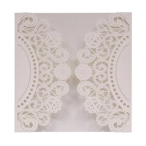 Detail showing laser-cut lace pattern and hollow design on a white wedding invitation sleeve