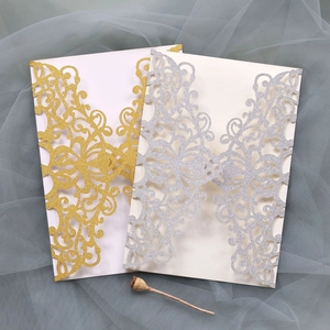 Lace laser cut wedding invitation covers in gold and silver glitter paper finish