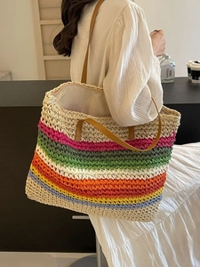 Rainbow striped woven straw tote bag with brown leather handles for summer vacation