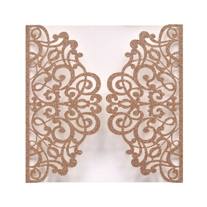 Laser cut gatefold wedding invitation cover with gold glitter finish and floral patterns