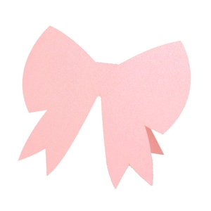 Detailed view of pink glitter bow card with shimmering texture for wedding table setting