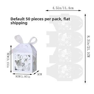 Flat lay of 50pcs laser cut white gift boxes with floral hollow pattern and assembly guide