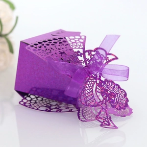 Detailed laser-cut purple gift box with lace patterns and a matching silk ribbon bow