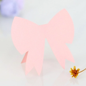 Close-up of pink 3D butterfly place cards with a subtle pearlescent shimmer finish