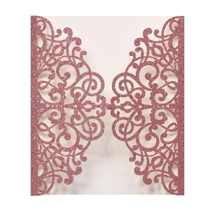 Pink glitter laser-cut invitation sleeve with ornate European vine patterns for weddings