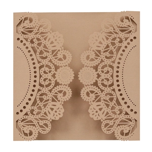 Detailed laser cut lace pattern on brown kraft paper wedding invitation envelope cover