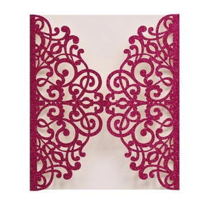 Laser-cut fuchsia glitter invitation cover with elegant European scroll patterns