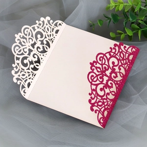 Detailed view of intricate laser-cut floral pattern with pink glitter texture on card