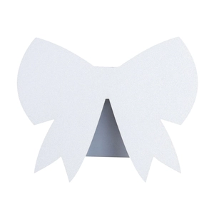 Close-up of white glitter bow seat card with laser-cut design for wedding table decor