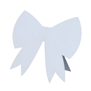 Detailed macro view of a white 3D paper bow-tie place card with elegant laser-cut edges