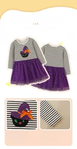 Detail of Halloween girls dress featuring black cat embroidery and purple sequin tulle skirt