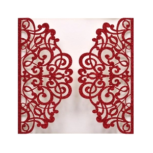 Laser cut red glitter wedding invitation card with intricate symmetrical scroll patterns