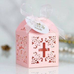 Detail of pink laser-cut cross gift box with ribbon and Thank You hanging tag