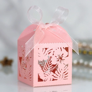 Detailed laser-cut hibiscus flower and leaf pattern on pink pearlescent gift box
