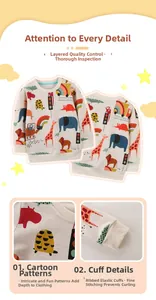 Detail of cotton kids sweatshirt featuring colorful animal prints and ribbed elastic cuffs