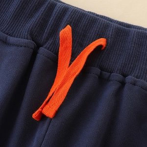 Boys navy blue cotton sweatpants with orange drawstring and cute dinosaur embroidery