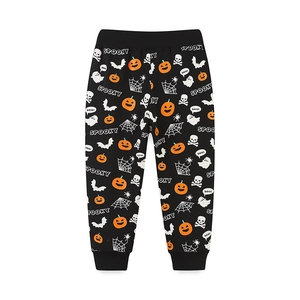 Halloween kids joggers with all-over pumpkin and ghost prints on black fabric