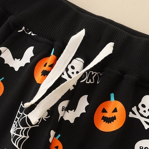 Halloween kids black joggers with pumpkin and skull prints featuring a ribbed waist