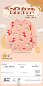 Detail of pink cotton sweatshirt featuring cute cartoon fox and hedgehog prints
