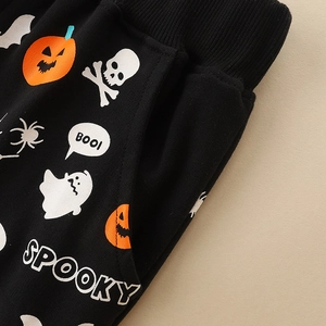 Kids Halloween sweatpants with pumpkin and ghost prints on black cotton fabric