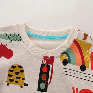 Kids cotton sweatshirt featuring colorful cartoon animal prints on a beige-gray fabric