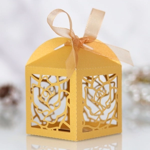 Detailed laser-cut rose hollow candy box with gold organza ribbon for weddings