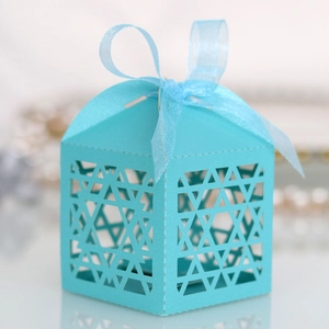 Detail of light blue laser-cut Star of David candy box with matching organza ribbon bow
