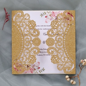 Detailed laser cut gold glitter wedding invitation with elegant pink floral inner card