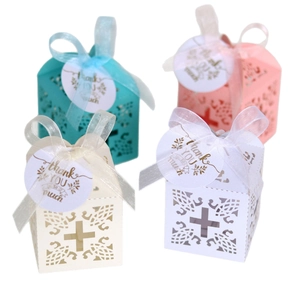 Laser cut favor boxes with cross pattern and thank you tags in various colors