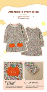 Detailed embroidery of orange pumpkins and floral patterns on girl's cotton dress