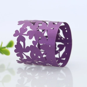Detail showing the laser-cut purple butterfly paper napkin ring with a pearlescent finish