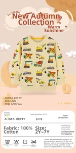 Detailed view of yellow cotton kids sweatshirt with cartoon construction vehicle prints