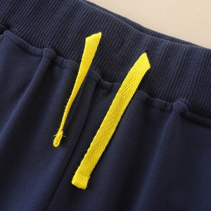 Pantalon de jogging bleu marine garçon avec taille élastique et cordons jaune vif