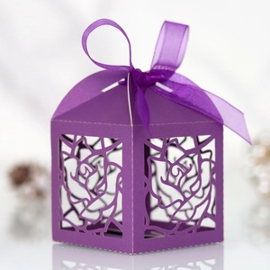 Detailed laser-cut rose pattern on purple gift candy box with matching silk ribbon bow