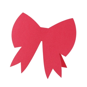 Macro detail of red paper 3D bow seating card with laser-cut texture and elegant paper finish