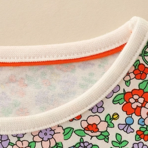 Girl's autumn floral dress with pumpkin embroidery and vibrant orange collar detail