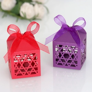 Laser-cut star hollow candy boxes in red and purple with elegant organza ribbon bows