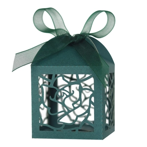 Detailed laser cut rose pattern on dark green gift box with matching ribbon bow
