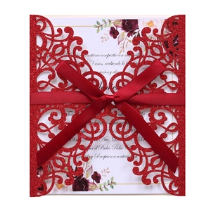 Red glitter hollow laser cut invitation card with elegant satin ribbon and floral insert