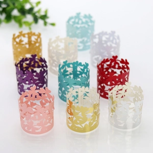 Detailed laser-cut hollow clover napkin rings in various pearlescent metallic colors