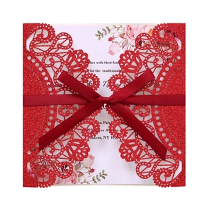 Laser cut red glitter wedding invitation with silk bow and floral insert card