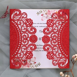 Detailed laser cut red glitter wedding invitation with elegant floral inner card insert