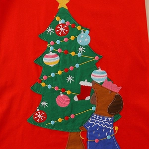 Girl's red long-sleeve Christmas dress featuring embroidered tree and dachshund detail